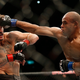 Iliarde Santos (r.) punches Ian McCall in the head.